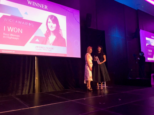 Jwerea Morgan is shown on stage, receiving her Women in Construction (WICE) award in 2017