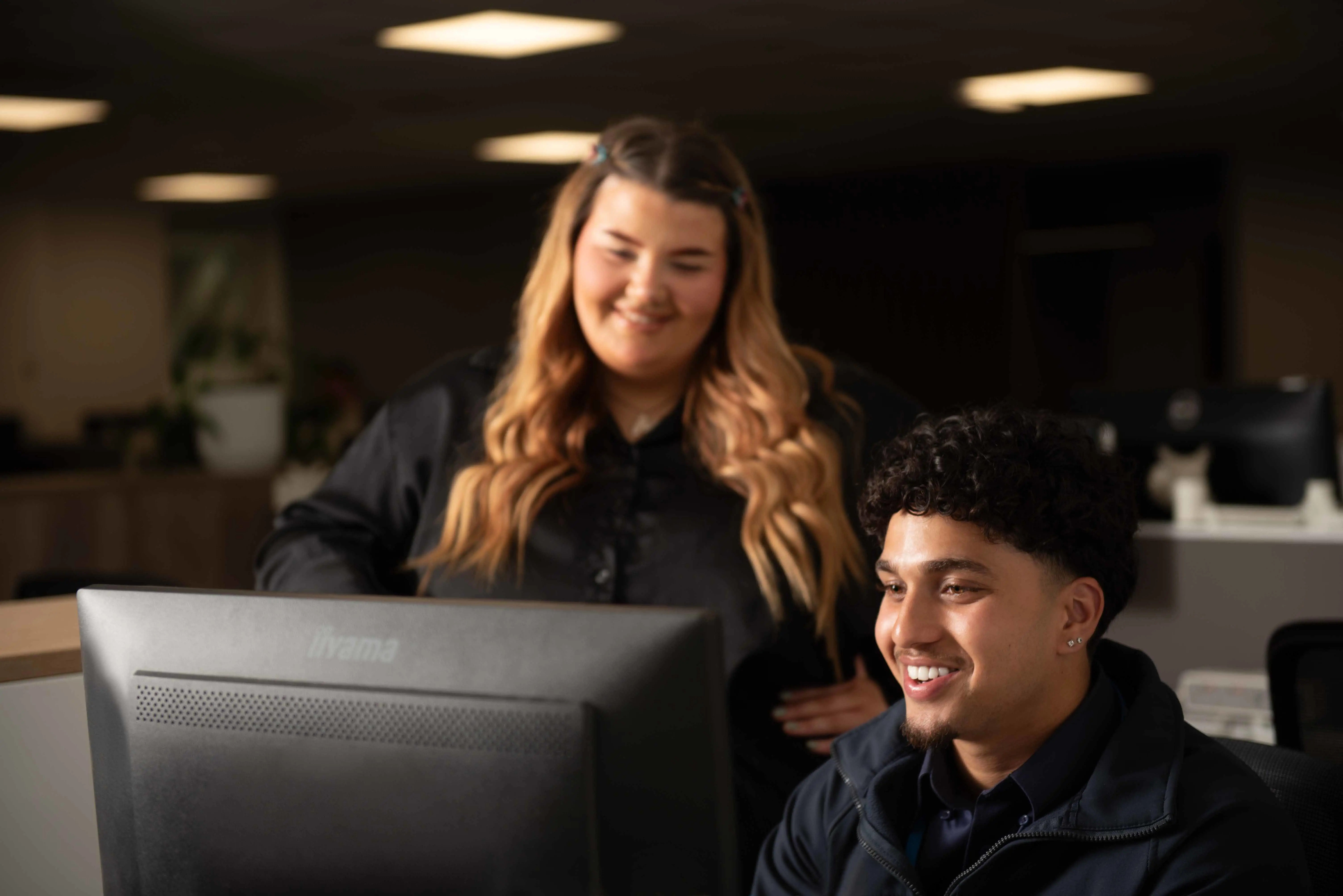 Two colleagues taking part in online learning