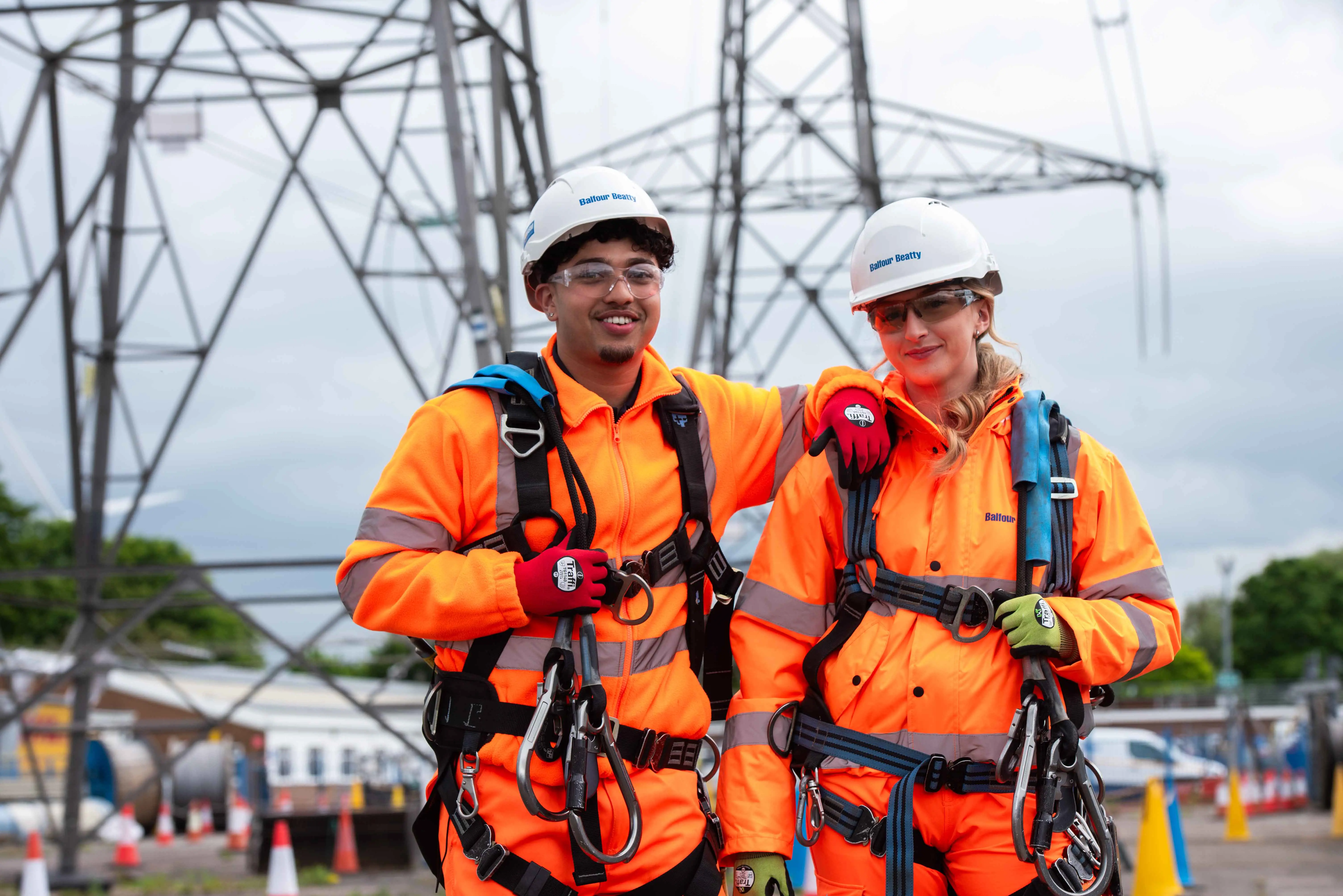 Two colleagues harnessed for working at height