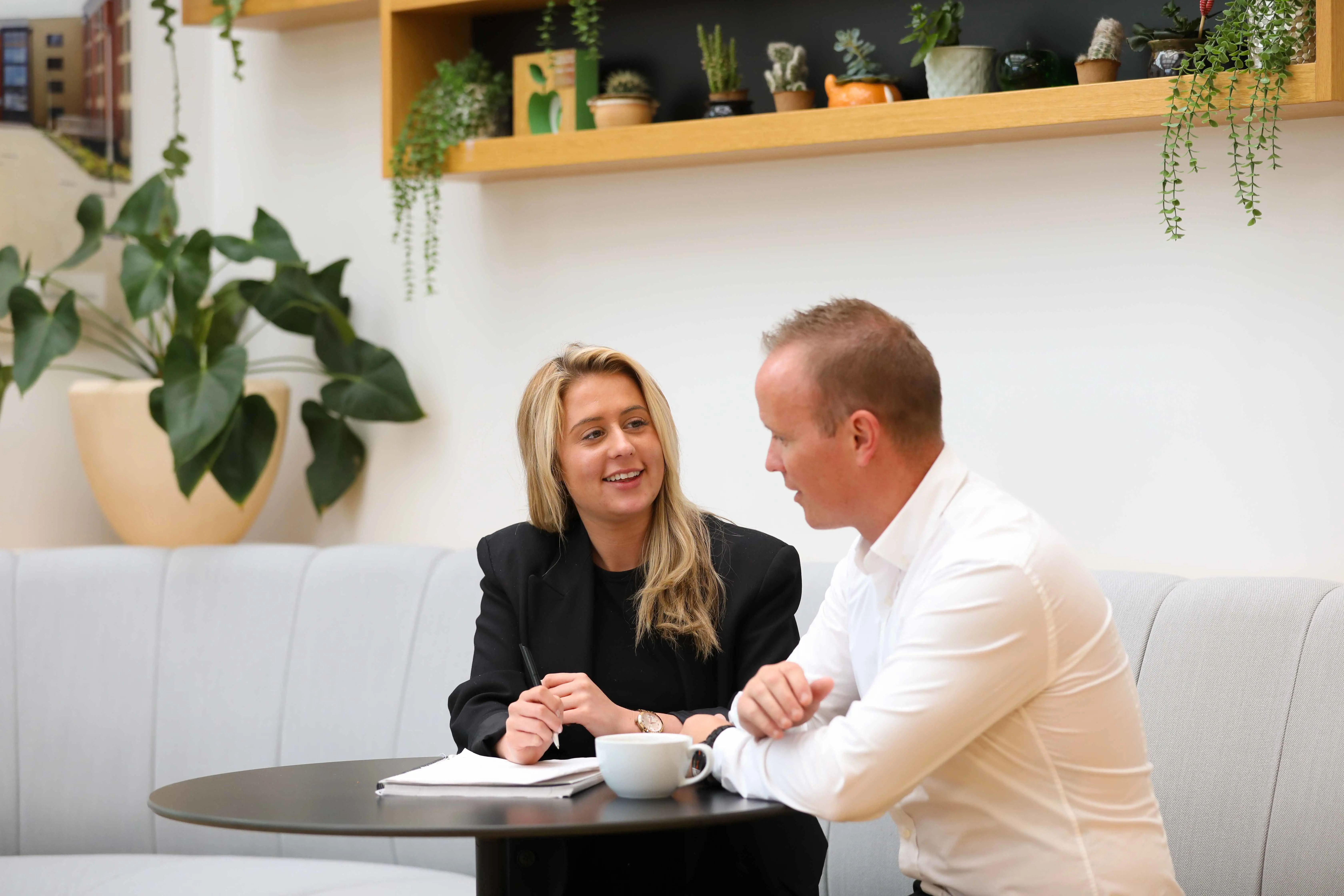 Two office-based colleagues in discussion
